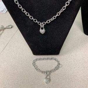 925 Sterling silver necklace & bracelet set. .09TW diamonds in each locket.